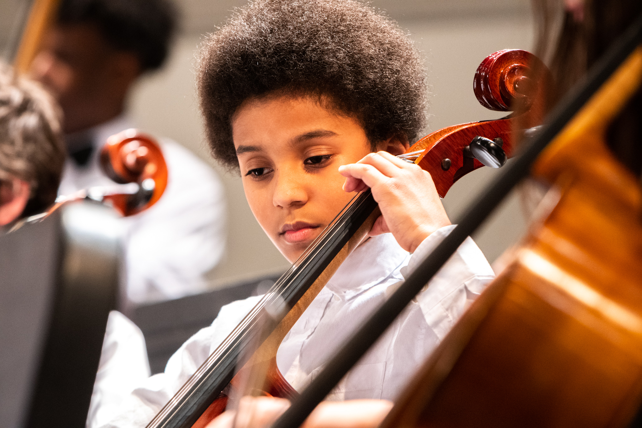 Young cellist playing in ESYO String Orchestra