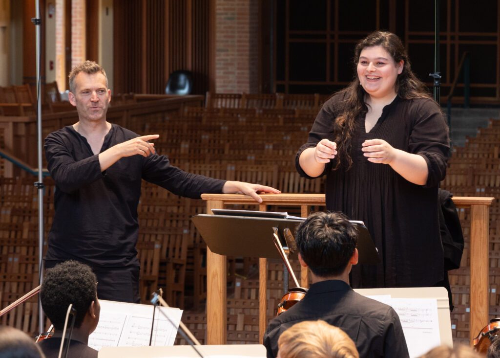 ESYO graduating senior Georgia took the podium for a fun hip-hop style conducting battle with ESYO Music Director and Symphony Orchestra conductor Etienne Abelin